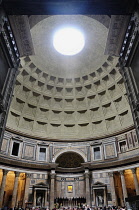 Italy, Lazio, Rome, Centro Storico, Pantheon, looking through the doorway with light streaming through the oculus.