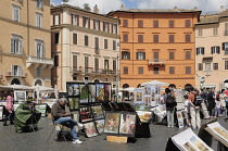Italy, Lazio, Rome, Centro Storico, Piazza Navona, general scene with artist stalls.