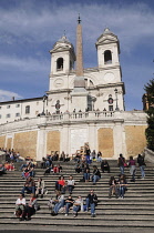 Italy, Lazio, Rome, Centro Storico, Piazza Spagna, people sitiing on the Spanish Steps.