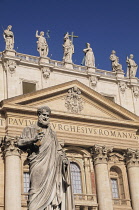 Italy, Lazio, Rome, Vatican City, St Peter's Square, statue of St Peter with Bsilica & balcony of the blessing.
