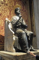 Italy, Lazio, Rome, Vatican City, St Peter's Square, St Peter's Basilica, bronze statue of St Peter with hand rubbing foot.