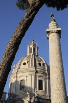 Italy, Lazio, Rome, Fori Imperiali, Trajan's Column with church dome & umbrella pine.