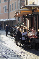 Italy, Lazio, Rome, Trastevere, Piazza di Santa Maria de Trastevere, cafes on the Piazza.