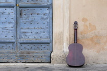 Italy, Lazio, Rome, Piazza de Santa Maria de Trastevere, guitar & wall.