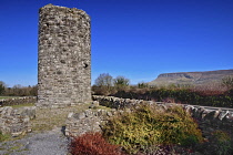 Ireland, County Sligo, Stump of 11th century round tower in Drumcliffe  with Ben Bulben mountain in the background.