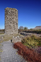 Ireland, County Sligo, Stump of 11th century round tower in Drumcliffe  with Ben Bulben mountain in the background.