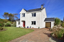 Ireland, County Sligo, Carney, suburban detached house with green lawn.