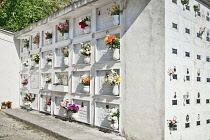 Italy, Liguria, Cinque Terre, Manarola, A section of the town cemetery above the town on Punta Bonfiglio with marble walls of niches wherein people are buried.