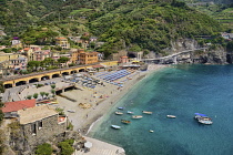 Italy, Liguria, Cinque Terre, Monterosso al Mare,  Vista of the Old Town with sandy beach in the foreground.