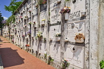 Italy, Liguria, Cinque Terre, Monterosso al Mare, A section of the town cemetery above the town with inscribed marble walls of niches wherein people are buried.