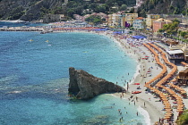 Italy, Liguria, Cinque Terre, Monterosso al Mare,  Vista of the New Town with sandy beach in the foreground.