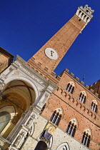 Italy, Tuscany, Siena, Angular view of the Torre del Mangia in Piazza del Campo.