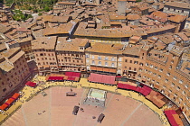 Italy, Tuscany, Siena, Piazza del Campo viewed from top of the Torre del Mangia with the Fonte Gaia or Fountain of the World prominent.