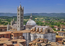 Italy, Tuscany, Siena, View of Siena Cathedral from the top of the Torre del Mangia in Piazza del Campo.