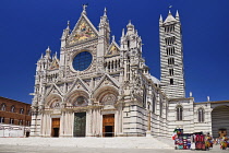 Italy, Tuscany, Siena, View of the facade of Siena Cathedral from Piazza del Duomo.