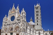 Italy, Tuscany, Siena, View of the upper facade of Siena Cathedral from Piazza del Duomo.