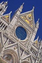 Italy, Tuscany, Siena, View of the central facade of Siena Cathedral from Piazza del Duomo.