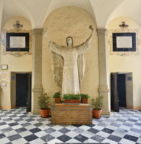Italy, Tuscany, Siena, Casa Santuario di Santa Caterina, Courtyard with large statue of St Catherine.