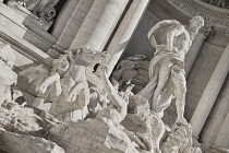 Italy, Lazio, Rome, Piazza di Trevi, Baroque Trevi Fountain or Fontana di Trevi showing statue of the Greek God Oceanus with his chariot being pulled by sea horses.