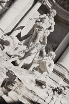 Italy, Lazio, Rome, Piazza di Trevi, Baroque Trevi Fountain or Fontana di Trevi showing statue of the Greek God Oceanus with his chariot being pulled by sea horses.