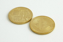 Finance, Money, Bitcoin, Fake gold coins with the bitcoin logo.