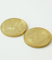 Finance, Money, Bitcoin, Fake gold coins with the bitcoin logo.