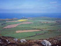 Wales, Pembrokeshire, View from Garn Fawr over farmland toward Stumble Head Lighthouse.