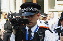 England, London, Police Video Surveillance Officer filming anti Trump demonstration.