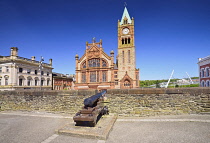 Northern Ireland, County Derry, The Guild Hall, view from the city's 17th century walls with a cannon in the foreground.