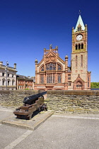 Northern Ireland, County Derry, The Guild Hall, view from the city's 17th century walls with a cannon in the foreground.