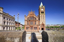 Northern Ireland, County Derry, The Guild Hall, view from the city's 17th century walls with a cannon in the foreground.