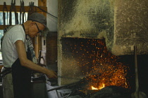 Japan, Traditional Blacksmith at work.