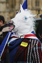 England, London, Westminster, Parliament Square, Brexit remain supporter wearing horse mask.