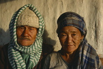 Nepal, Majwa Beisi, Portrait of elderly couple wearing headscarfs.