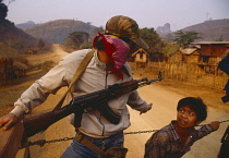 Laos, Armed guard on upcountry truck.