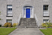 Ireland, County Offaly, Birr which is a town renowned for its Georgian architecture, John's Mall, elegant blue Georgian doorway with steps and an ornamental railing leading up to it.