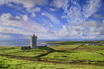Ireland, County Clare, Doonagore Castle which is a 16th century tower house above Doolin village.