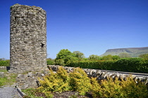 Ireland, County Sligo, Drumcliffe, Stump of Round Tower with Ben Bulben mountain in the background.