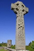 Ireland, County Sligo, Drumcliffe High Cross  with stump of Round Tower in the background.