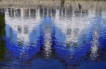 Ireland, County Sligo, Sligo town, High tech business hub building known as Building Blocks reflected in River Garavogue.