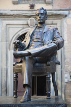 Italy, Tuscany, Lucca, Bronze statue of Giacomo Puccini in front of his birthplace Casa natale, now a museum.