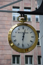 Germany, Berlin, Mitte, Friedrichstrasse, Brass pocket watch shop sign.