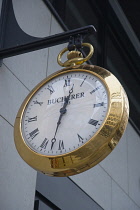Germany, Berlin, Mitte, Friedrichstrasse, Brass pocket watch shop sign.