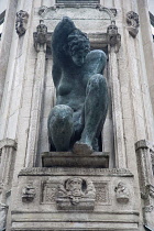 Germany, Berlin, Mitte, Detail of statue on building facade.