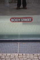 Germany, Berlin, Mitte, Zimmerstrasse, Body Street sign on window.