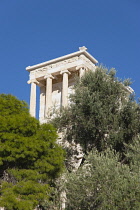 Greece, Attica, Athens, Acropolis ruins seen through trees.