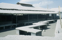 West Indies, Monserrat, Plymouth, Town buildings covered in layer of volcanic ash after 1997 eruption.