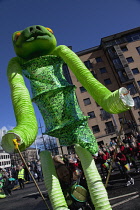 Ireland, North, Belfast, St Patricks Day parade passing the Albert clock on the corner of High Street and Victoria Street.