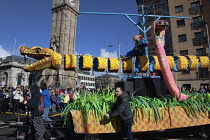 Ireland, North, Belfast, St Patricks Day parade passing the Albert clock on the corner of High Street and Victoria Street.