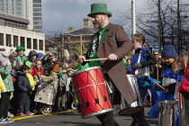 Ireland, North, Belfast, St Patricks Day parade passing the Albert clock on the corner of High Street and Victoria Street.